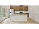 Open kitchen with stainless steel appliances, granite countertops, and an island with a sink at 2770 Aralynn Way, College Park, GA 30337