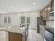 Open concept kitchen featuring granite counters, stainless appliances, and a center island at 2770 Aralynn Way, College Park, GA 30337