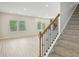 Cozy living room with a stairway, abundant natural light, and hardwood floors at 2770 Aralynn Way, College Park, GA 30337