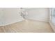 Bright living room features hardwood floors, and an adjacent staircase at 2770 Aralynn Way, College Park, GA 30337