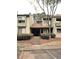 Two story unit featuring stairs leading to the entrance and complemented by manicured shrubs at 315 Seasons Pkwy, Norcross, GA 30093