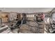 Bright community gym featuring modern fitness equipment, exercise machines, weights and natural light from the large windows at 315 Seasons Pkwy, Norcross, GA 30093
