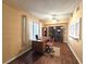 A well-lit home office with a large window and wood-look flooring at 315 Seasons Pkwy, Norcross, GA 30093