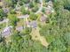 Aerial view of the property showcasing the house and expansive wooded lot at 3442 Inns Brook Way, Snellville, GA 30039