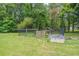 Large backyard with a wooden fence and mature trees at 3442 Inns Brook Way, Snellville, GA 30039