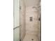 This bathroom features a modern tile shower with rainfall showerhead and glass door at 3442 Inns Brook Way, Snellville, GA 30039