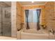 Modern bathroom features include a separate shower and bathtub with a window at 3442 Inns Brook Way, Snellville, GA 30039