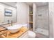 Bathroom with a stand-alone sink, modern fixtures, and a shower with glass door at 3442 Inns Brook Way, Snellville, GA 30039