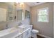 This bathroom features double vessel sinks, modern fixtures, and a window for natural light at 3442 Inns Brook Way, Snellville, GA 30039