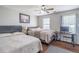 This bedroom features 2 queen beds, hardwood flooring and a ceiling fan at 3442 Inns Brook Way, Snellville, GA 30039