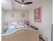 Bedroom with a decorative headboard, ceiling fan, and ample natural light at 3442 Inns Brook Way, Snellville, GA 30039