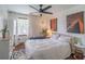 Cozy bedroom with a large window providing natural light and ceiling fan at 3442 Inns Brook Way, Snellville, GA 30039
