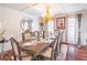 Formal dining room with elegant chandelier, large table, and sophisticated decor at 3442 Inns Brook Way, Snellville, GA 30039
