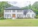 Charming two-story home with white brick exterior, gray shutters, and a lush green lawn at 3442 Inns Brook Way, Snellville, GA 30039