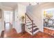 Beautiful entry hall featuring hardwood floors, staircase, and elegant finishes at 3442 Inns Brook Way, Snellville, GA 30039