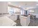 Updated kitchen featuring white marble countertops, stainless steel appliances, and a modern island cooktop at 3442 Inns Brook Way, Snellville, GA 30039