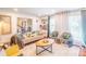 Bright living room with hardwood floors, large windows, and comfortable seating at 3442 Inns Brook Way, Snellville, GA 30039