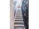 View of staircase with custom paneling and design leading to the second story of the home at 3442 Inns Brook Way, Snellville, GA 30039