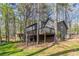 A beautiful backyard with mature trees at 477 Victoria Rd, Woodstock, GA 30189