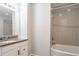 Bathroom with a modern sink, granite countertop, tub and shower combination and subway tile surround at 477 Victoria Rd, Woodstock, GA 30189