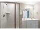 The bathroom features a double sink vanity and glass enclosed shower with subway tile surround at 477 Victoria Rd, Woodstock, GA 30189
