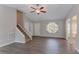 Inviting living room featuring wood floors, a staircase, and ample natural light at 477 Victoria Rd, Woodstock, GA 30189