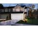 Charming two-story home showcasing a stone facade and well-manicured landscaping at 344 White Tail Rd, Stockbridge, GA 30253