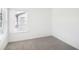Bright bedroom featuring a window with blinds and neutral carpeting at 352 White Tail Rd, Stockbridge, GA 30253