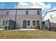 Backyard featuring a small patio, lawn, and view of the home's exterior at 360 White Tail Rd, Stockbridge, GA 30253
