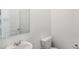 Simple bathroom with a sink, mirror, and toilet at 364 White Tail Rd, Stockbridge, GA 30253