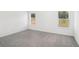 Spacious bedroom with plush carpet and two bright windows at 345 White Tail Rd, Stockbridge, GA 30253