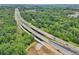 Aerial view showcasing the property's proximity to highways and lush greenery, highlighting accessibility and serenity at 1780 Riverglen Dr, Suwanee, GA 30024