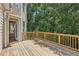 Spacious back deck with access to the home, perfect for outdoor dining or enjoying the wooded views at 1780 Riverglen Dr, Suwanee, GA 30024