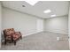 Spacious basement with carpet floors, recessed lighting, and a double door at 1780 Riverglen Dr, Suwanee, GA 30024