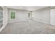 Finished basement space with plush carpet, neutral walls, and recessed lighting, ideal for entertaining at 1780 Riverglen Dr, Suwanee, GA 30024