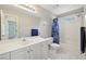 Bathroom featuring shower, bathtub, sink, white cabinets, and ceramic tile floors at 1780 Riverglen Dr, Suwanee, GA 30024