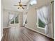 Spacious bedroom featuring vaulted ceilings, many windows, and hardwood floors at 1780 Riverglen Dr, Suwanee, GA 30024