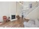 Spacious living room showcases hardwood floors, fireplace, high ceilings, and natural light at 1780 Riverglen Dr, Suwanee, GA 30024