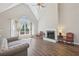 Living room with vaulted ceilings, hardwood floors, fireplace and comfortable seating at 1780 Riverglen Dr, Suwanee, GA 30024