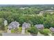 Charming two-story homes with manicured lawns and mature trees lining the street at 1780 Riverglen Dr, Suwanee, GA 30024