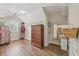 Spacious walk-in closet featuring custom shelving and hardwood floors at 1780 Riverglen Dr, Suwanee, GA 30024
