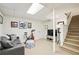 Finished basement with an exercise bike, sofa, and a staircase at 2506 Parkdale Ne Pl, Atlanta, GA 30305