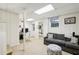 Finished basement space with an office area, sofa, and shelving at 2506 Parkdale Ne Pl, Atlanta, GA 30305