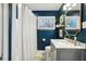 Bathroom featuring a vanity with a marble countertop, a large mirror, and a toilet at 2506 Parkdale Ne Pl, Atlanta, GA 30305