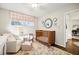 Cozy Bedroom with a crib, chair, ottoman, and a patterned rug at 2506 Parkdale Ne Pl, Atlanta, GA 30305