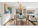 Sunlit dining area with chandelier, round table and view through a doorway to living room at 2506 Parkdale Ne Pl, Atlanta, GA 30305