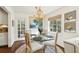 Bright dining area featuring a glass table and view to a door to the exterior at 2506 Parkdale Ne Pl, Atlanta, GA 30305