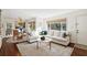 Inviting living room features a large window, modern decor, and a view into the dining area at 2506 Parkdale Ne Pl, Atlanta, GA 30305