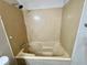 Bathroom features a well-lit bath and shower combination at 5806 Par Four Ct, Lithonia, GA 30038