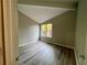 Cozy bedroom with hardwood flooring and a bright, large window at 5806 Par Four Ct, Lithonia, GA 30038